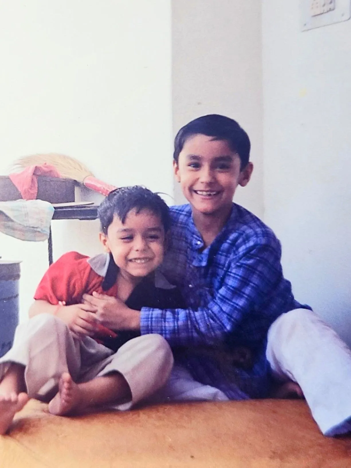 Abhinav as a kid, laughing with a cousin
