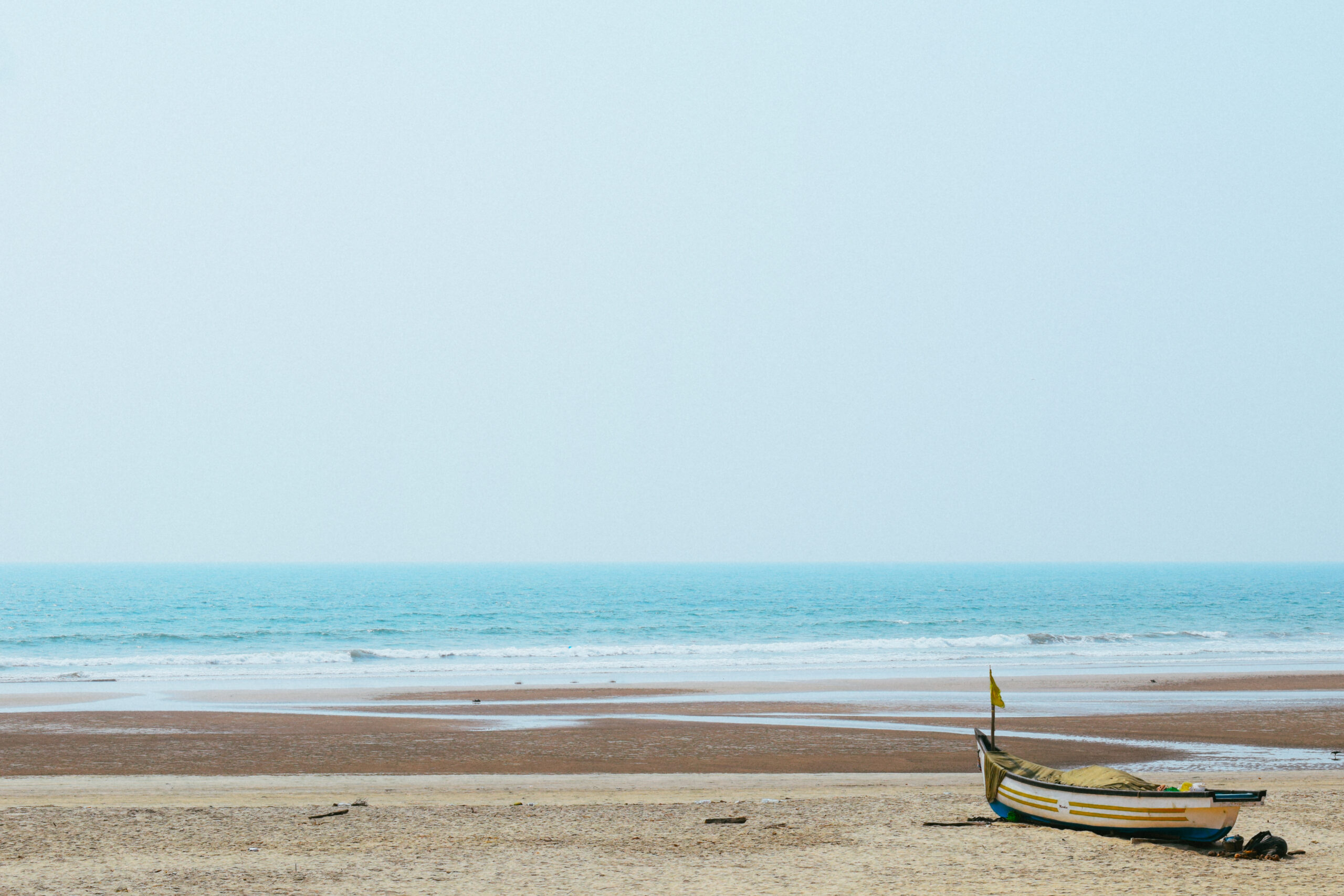 Solitary boat on Mandrem beach, Goa